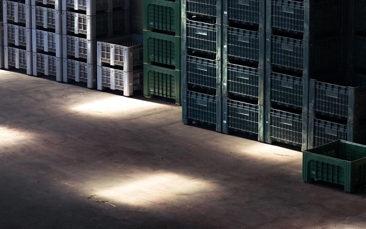 Stacked industrial storage crates in a warehouse